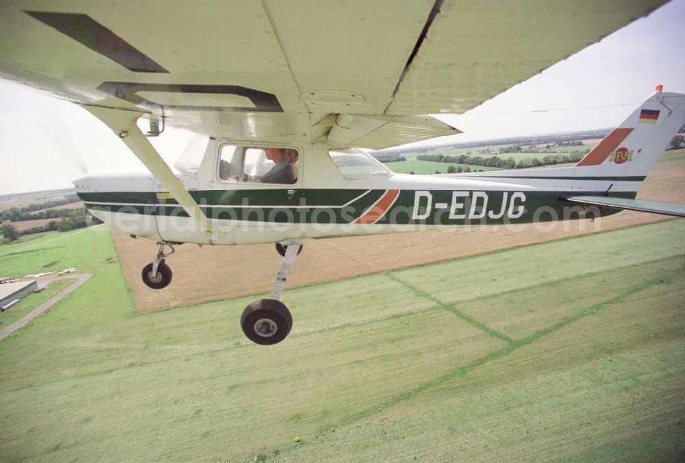 Paulinenaue from the bird's eye view: Cessna 150 with the identifier D-EDJG Aircraft in flight over the airspace on street Lindholzfarm in the district Selbelang in Paulinenaue in the state Brandenburg, Germany