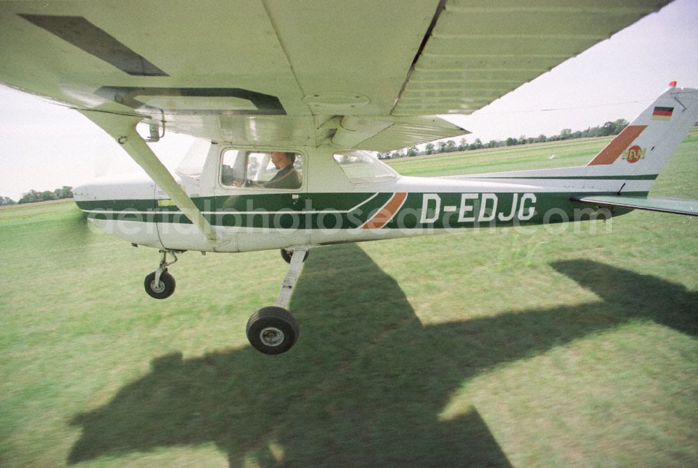 Aerial image Paulinenaue - Cessna 150 with the identifier D-EDJG Aircraft in flight over the airspace on street Lindholzfarm in the district Selbelang in Paulinenaue in the state Brandenburg, Germany