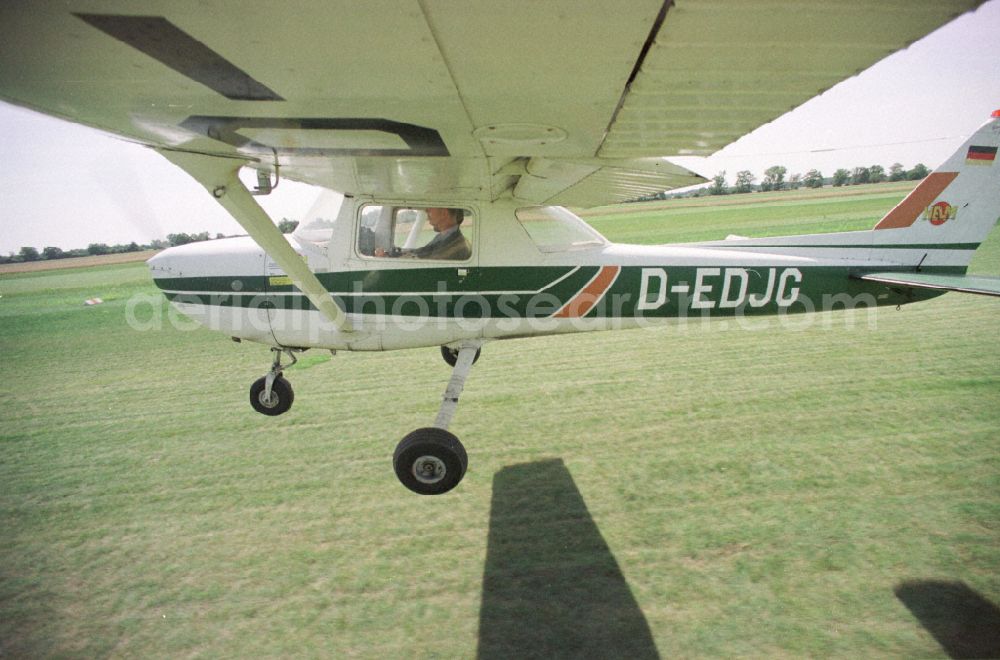 Aerial photograph Paulinenaue - Cessna 150 with the identifier D-EDJG Aircraft in flight over the airspace on street Lindholzfarm in the district Selbelang in Paulinenaue in the state Brandenburg, Germany