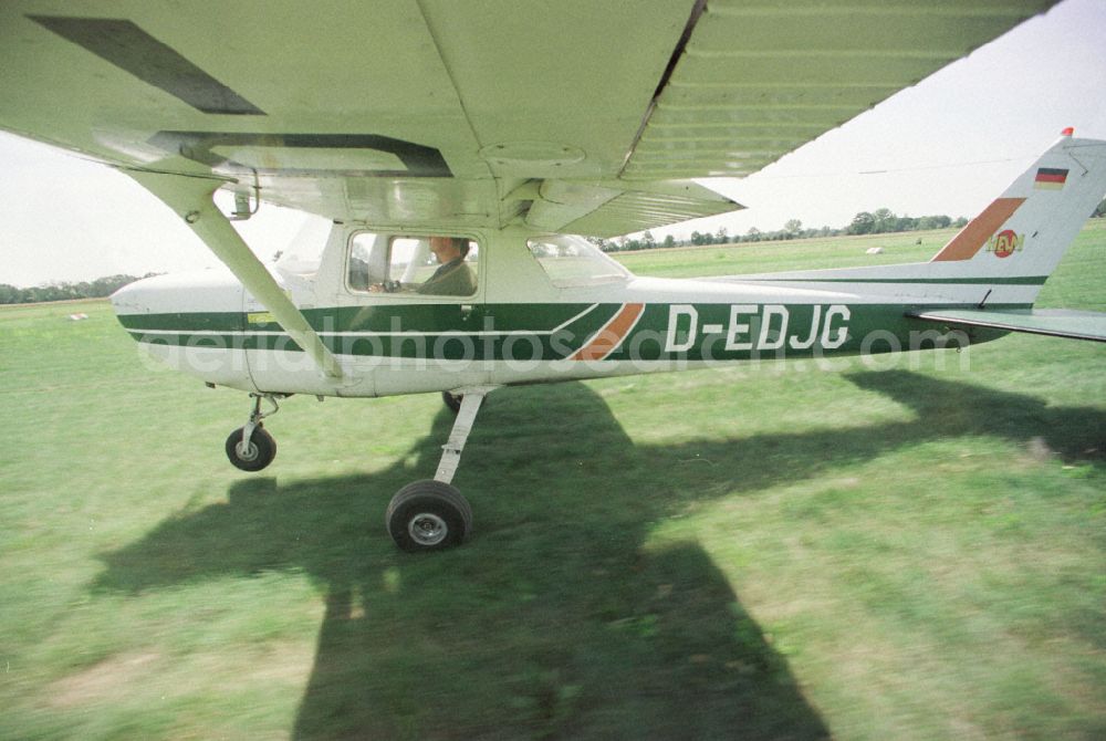 Paulinenaue from above - Cessna 150 with the identifier D-EDJG Aircraft in flight over the airspace on street Lindholzfarm in the district Selbelang in Paulinenaue in the state Brandenburg, Germany