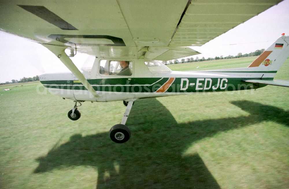 Paulinenaue from above - Cessna 150 with the identifier D-EDJG Aircraft in flight over the airspace on street Lindholzfarm in the district Selbelang in Paulinenaue in the state Brandenburg, Germany