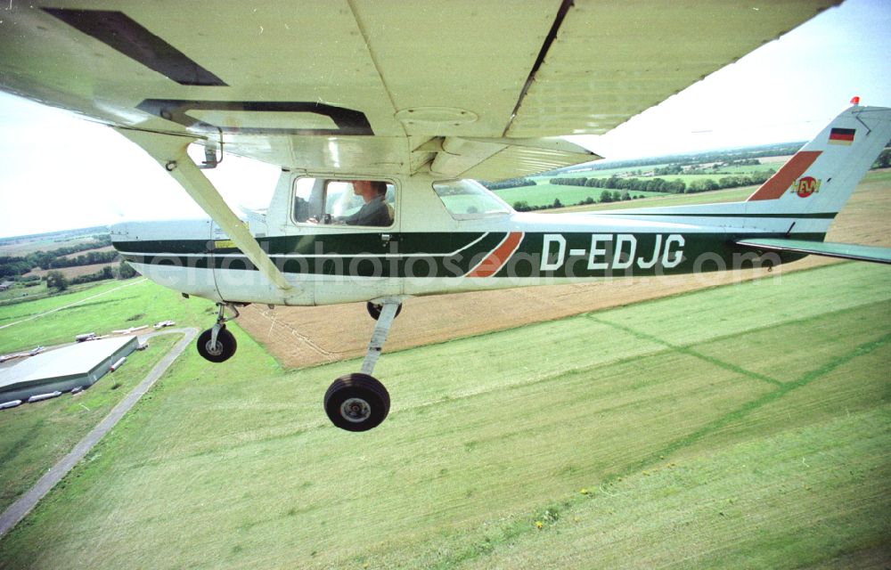 Paulinenaue from the bird's eye view: Cessna 150 with the identifier D-EDJG Aircraft in flight over the airspace on street Lindholzfarm in the district Selbelang in Paulinenaue in the state Brandenburg, Germany