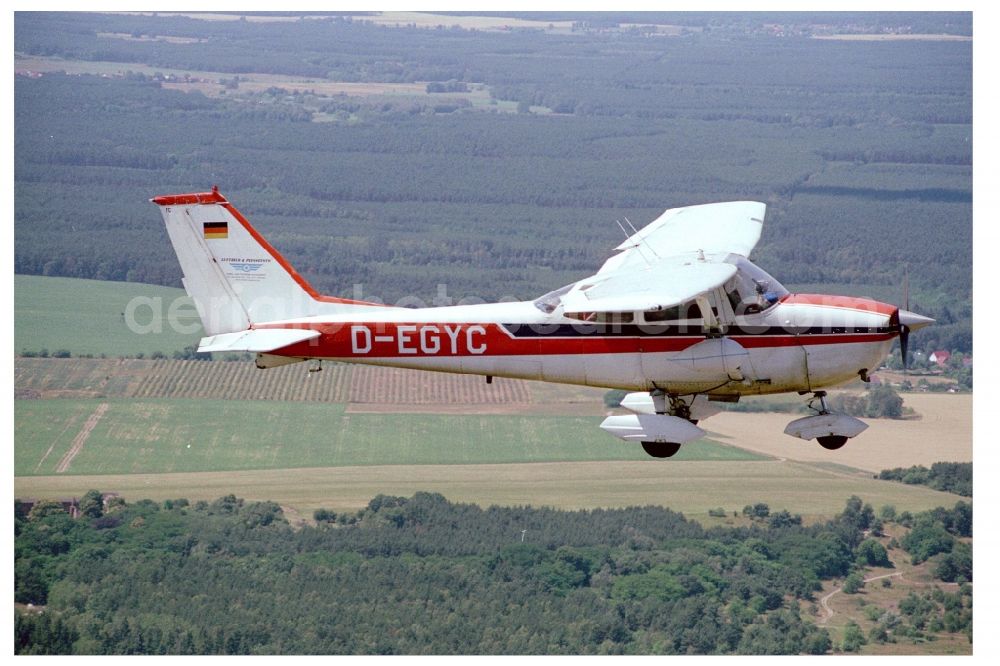 Fürstenwalde/Spree from the bird's eye view: Cessna F172H with call sign D-EGYC Aircraft in flight over the airspace in Fuerstenwalde/Spree in the state Brandenburg, Germany