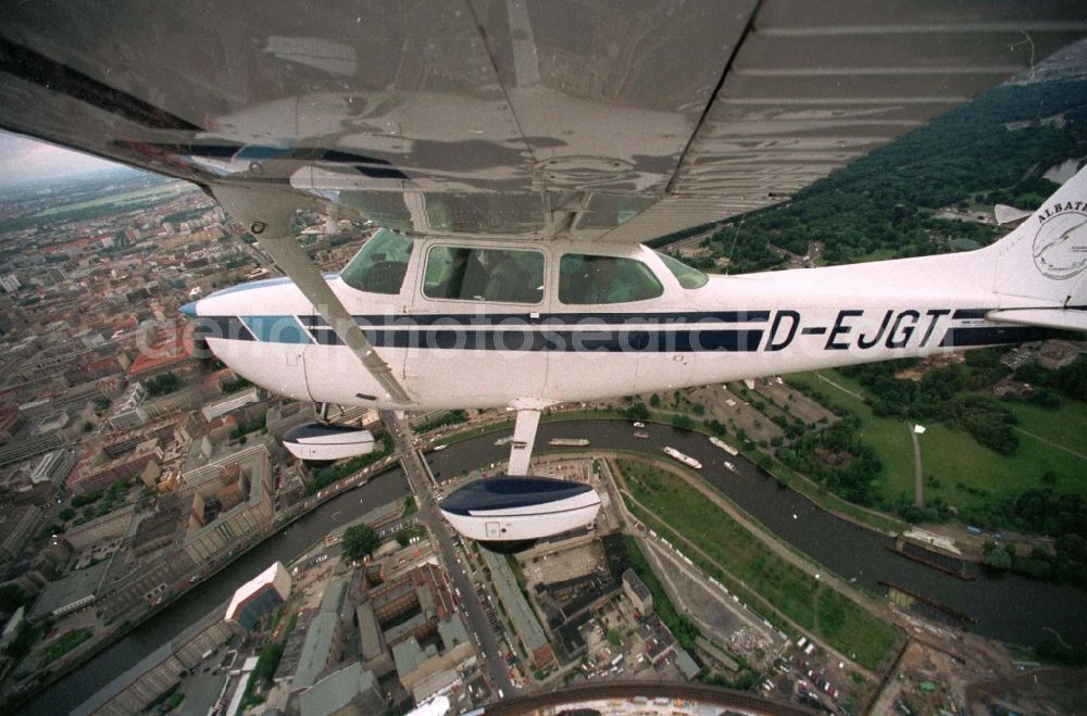 Aerial image Berlin - Cessna 172 with the identifier D-EJGT Aircraft in flight over the airspace in the district Tiergarten in Berlin, Germany