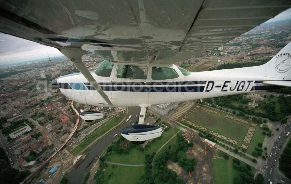 Berlin from above - Cessna 172 with the identifier D-EJGT Aircraft in flight over the airspace in the district Tiergarten in Berlin, Germany