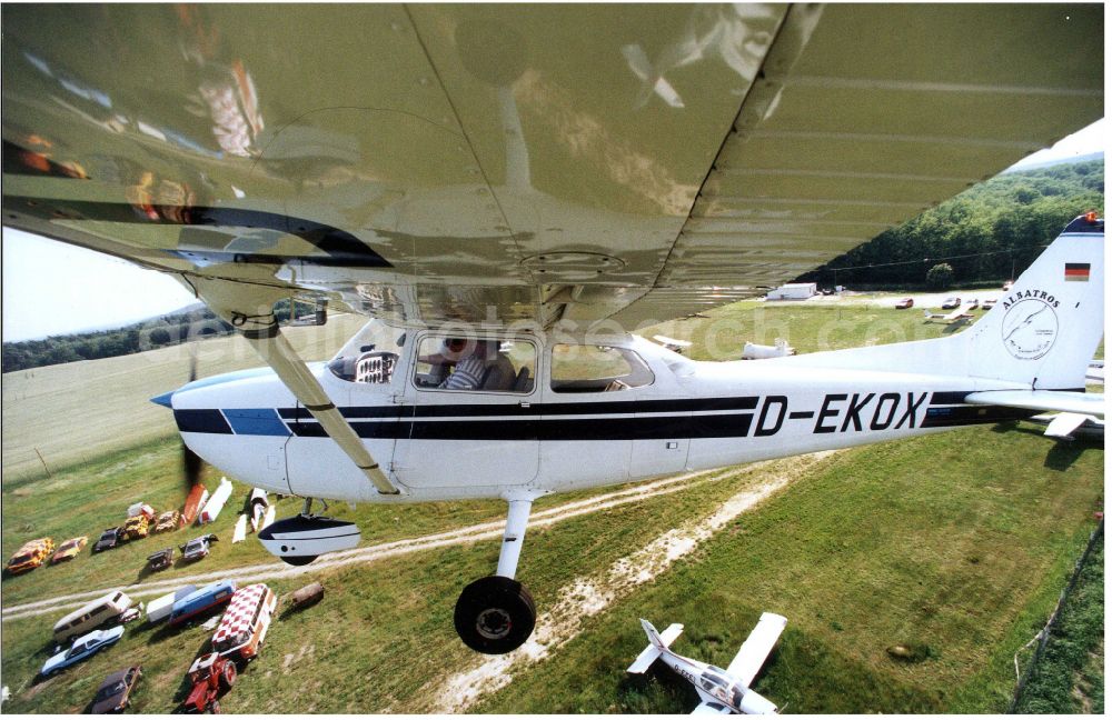 Aerial photograph Saarmund - Cessna 172 with the identifier D-EKOX Aircraft in flight over the airspace in Saarmund in the state Brandenburg, Germany