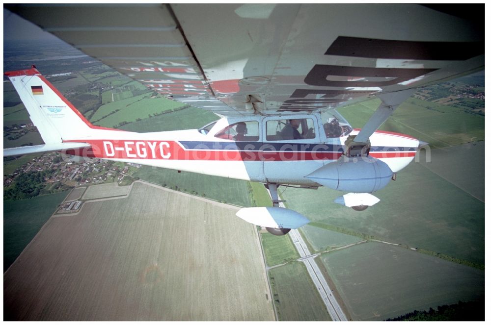 Groß Kienitz from the bird's eye view: Cessna 172 with the identifier D-EGYC Aircraft in flight over the airspace in Gross Kienitz in the state Brandenburg, Germany