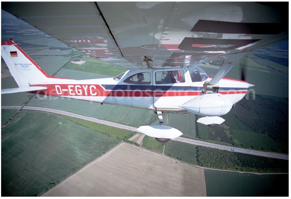 Groß Kienitz from the bird's eye view: Cessna 172 with the identifier D-EGYC Aircraft in flight over the airspace in Gross Kienitz in the state Brandenburg, Germany