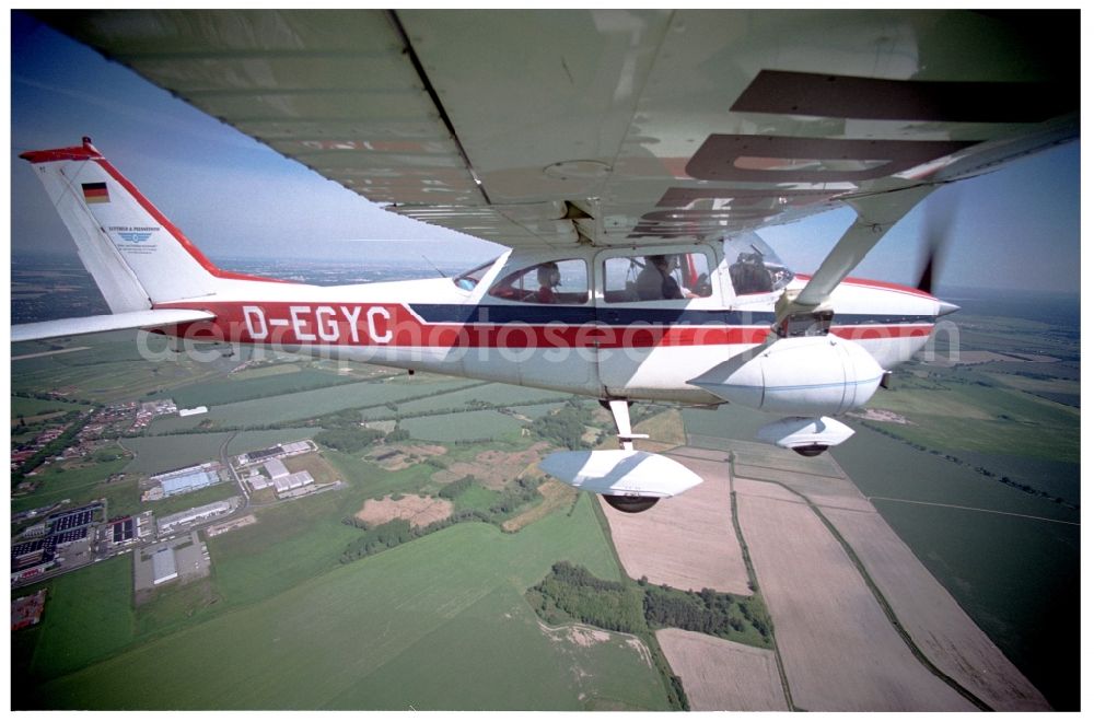 Aerial photograph Groß Kienitz - Cessna 172 with the identifier D-EGYC Aircraft in flight over the airspace in Gross Kienitz in the state Brandenburg, Germany