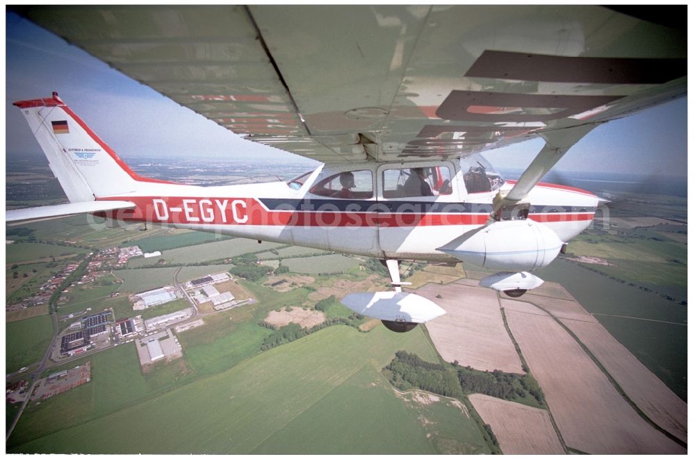 Groß Kienitz from the bird's eye view: Cessna 172 with the identifier D-EGYC Aircraft in flight over the airspace in Gross Kienitz in the state Brandenburg, Germany