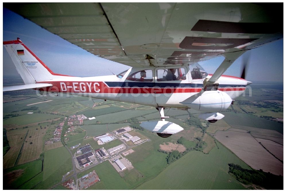 Aerial photograph Groß Kienitz - Cessna 172 with the identifier D-EGYC Aircraft in flight over the airspace in Gross Kienitz in the state Brandenburg, Germany