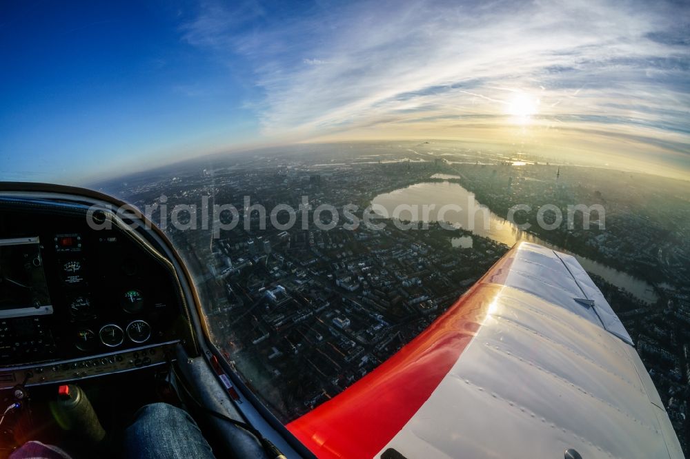 Aerial image Hamburg - Airplane DR-400 D-EBSF in flight over Aussenalster and district view of the inner city of Hamburg in Hamburg, Germany. The lake is located in the north of the city center and the old town of the Hansestadt