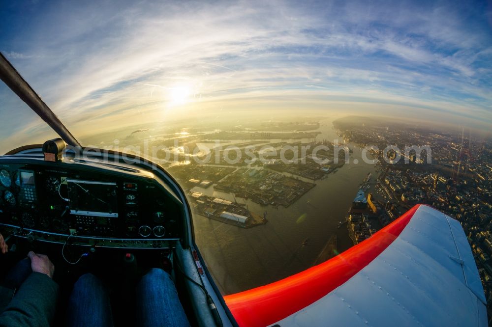 Aerial photograph Hamburg - Airplane DR-400 D-EBSF in flight over the Elbe and the Elbphilharmonie in Hamburg, Germany. The Elbphilharmonie is a concert hall built in 2016 in Hamburg