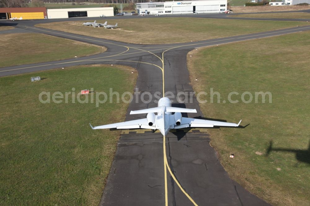 Egelsbach from above - Private jet aircraft EMB-505 Phenom 300 with the registration D-CRCR on the taxiway of Egelsbach Airport in Hesse