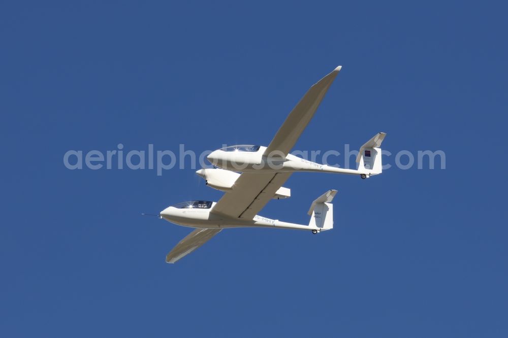 Stuttgart from the bird's eye view: Aircraft with emission-free hydrogen drive of the H2FLY GmbH with the identification S5-MHY in flight over the airspace in Stuttgart in the state of Baden-Wuerttemberg