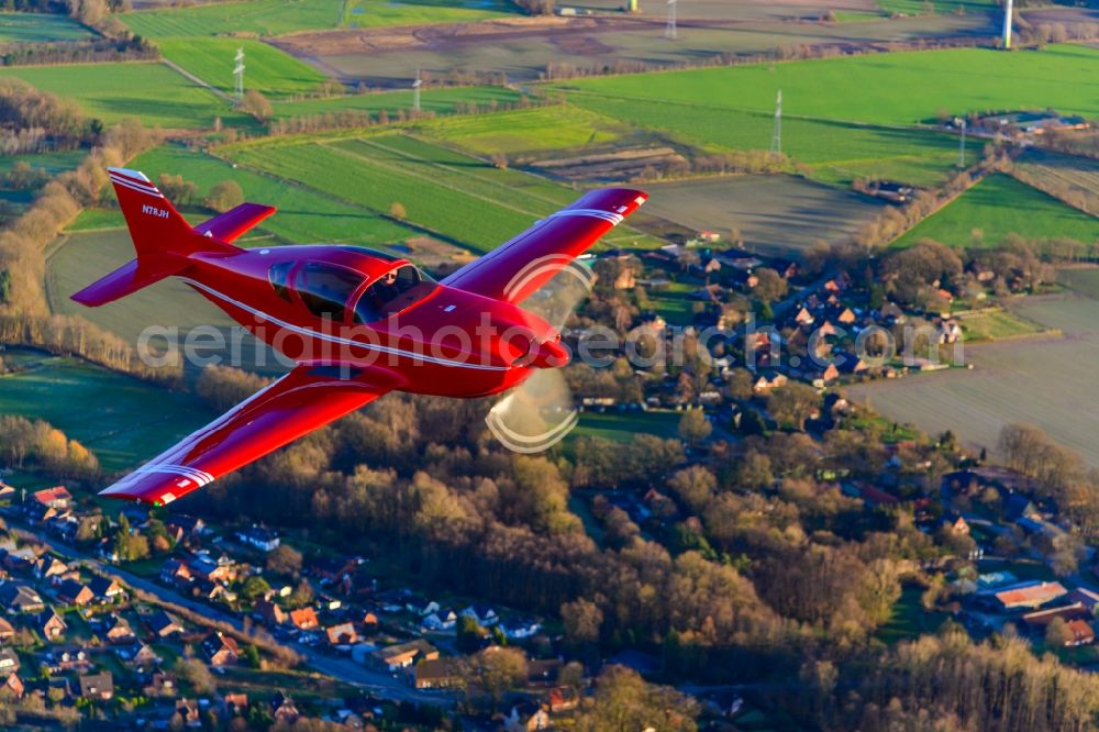 Aerial image Deinste - Glasair SH2R Aircraft in flight over the fields above Deinste in the state Lower Saxony, Germany