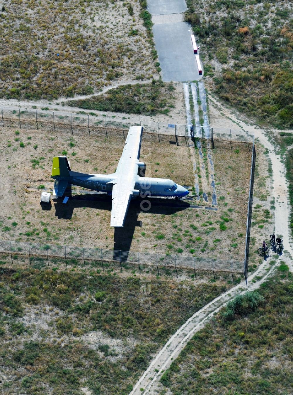 Aerial image Berlin - Decaying remnants of an airplane wreck Nord-Aviation N 262 Cauf dem ehemaligen Flugfeld of Tempelhofer Felof in the district Neukoelln in Berlin, Germany