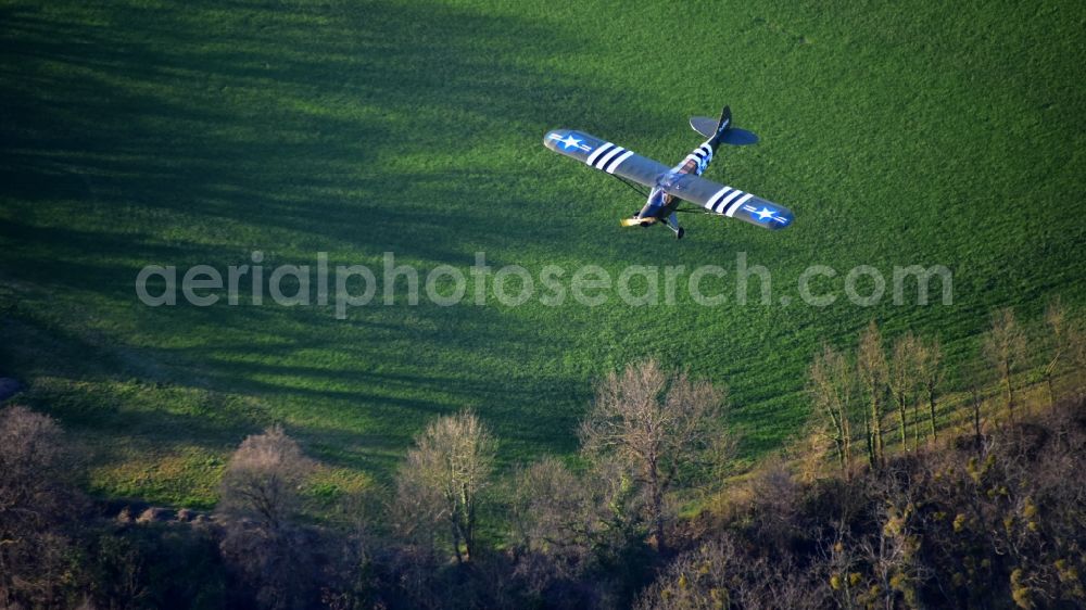 Königswinter from the bird's eye view: Airplane Piper L-4 in the airspace of Koenigswinter in the state North Rhine-Westphalia, Germany