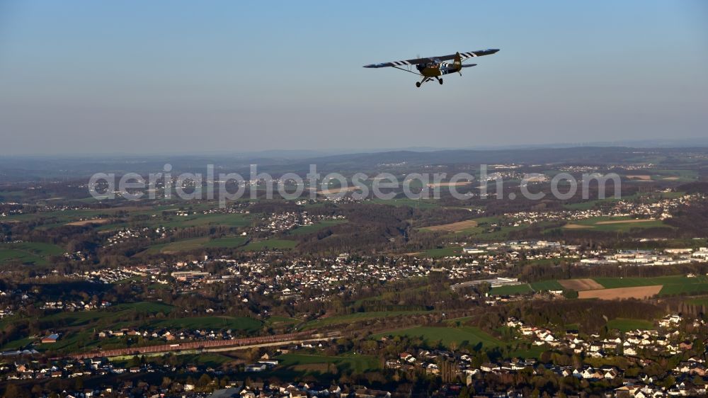 Aerial photograph Königswinter - Airplane Piper L-4 in the airspace of Koenigswinter in the state North Rhine-Westphalia, Germany