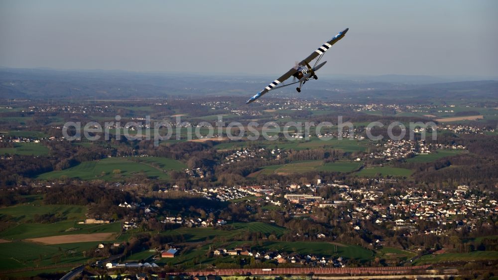 Königswinter from above - Airplane Piper L-4 in the airspace of Koenigswinter in the state North Rhine-Westphalia, Germany