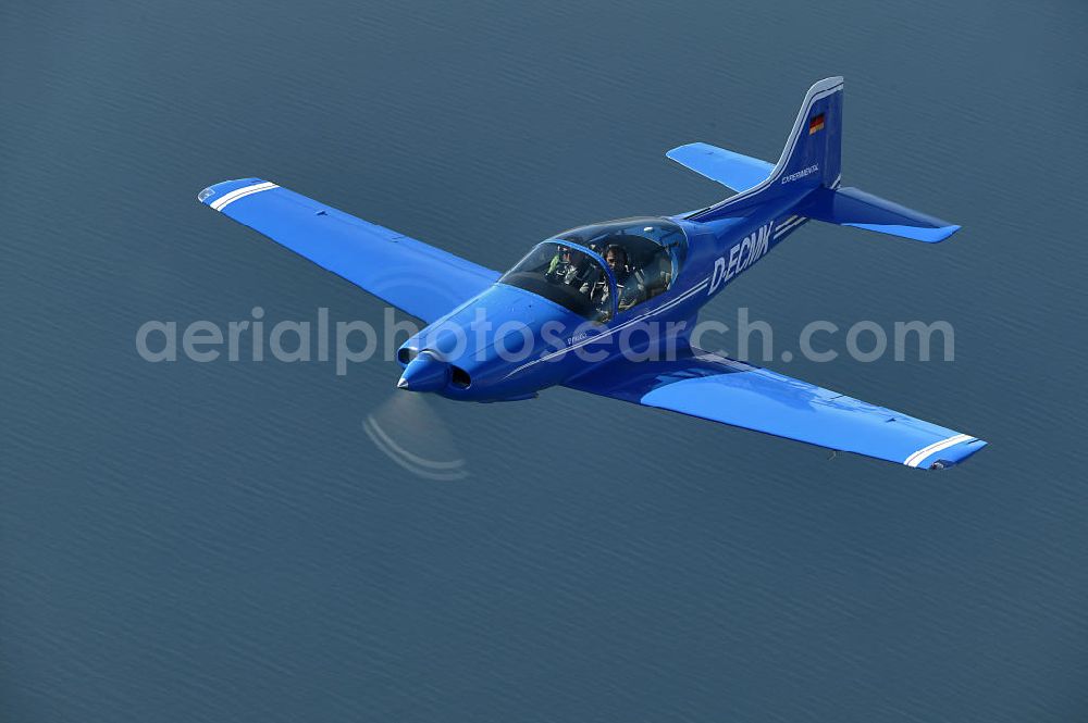 Aerial image Friedrichshafen - Flugzeug / Kleinflugzeug vom Typ Sequoia F.8L Falco mit der Kennung D-ECMK über dem Bodensee in der Nähe vom Flughafen Bodensee-Airport Friedrichshafen in Baden-Württemberg. Small aircraft over the Lake Constance by the near of Friedrichshafen Airport in Baden-Wuerttemberg.