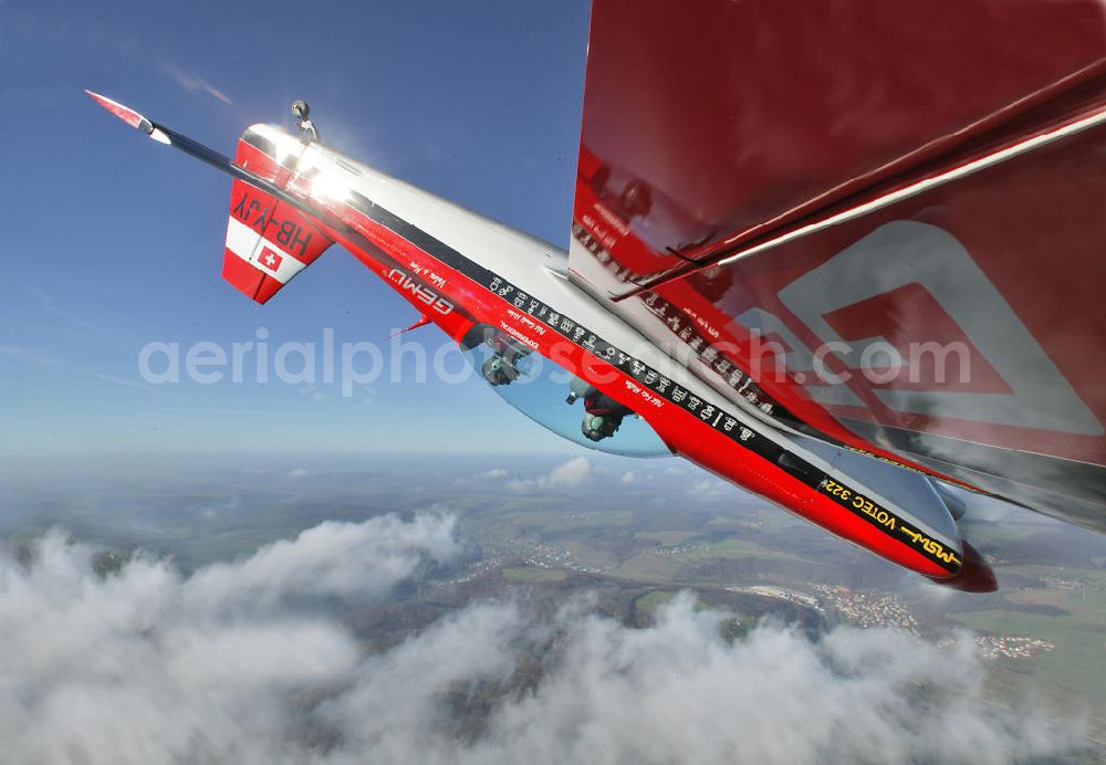 Heilbronn from the bird's eye view: Kunstflugzeug / Flugzeug vom Typ VOTEC 322 mit der schweizer Kennung HB-YJY über Heilbronn in Baden-Württemberg. Aerobatic aircraft over Heilbronn in Baden-Wuerttemberg.