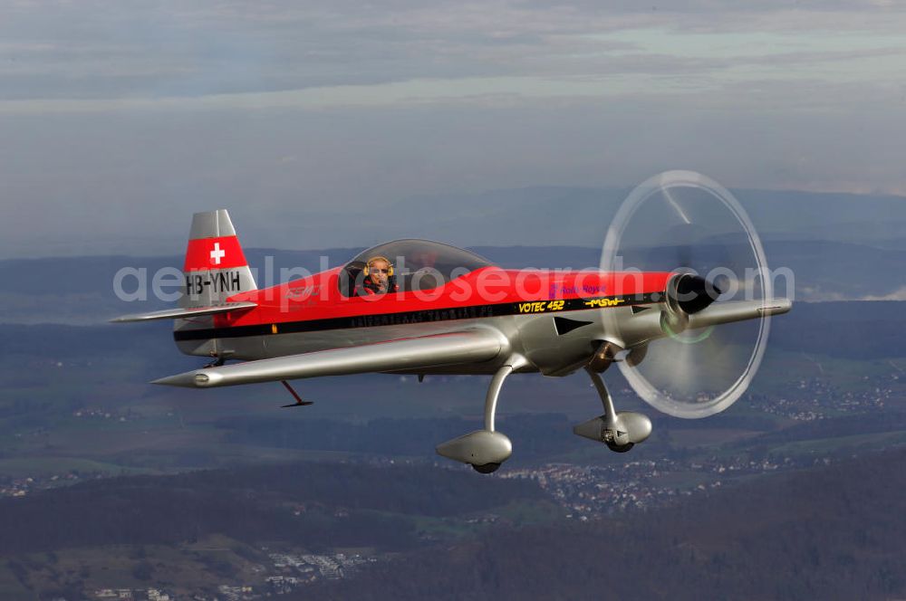 Aerial image Birrfeld - Kunstflugzeug / Flugzeug vom Typ VOTEC 452 mit der schweizer Kennung HB-YNH nahe dem Flugplatz Birrfeld / Schweiz. Aerobatic aircraft near by the Birrfeld airfield in Switzerland.