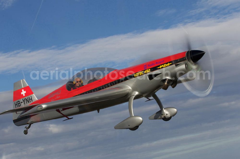 Aerial image Birrfeld - Kunstflugzeug / Flugzeug vom Typ VOTEC 452 mit der schweizer Kennung HB-YNH nahe dem Flugplatz Birrfeld / Schweiz. Aerobatic aircraft near by the Birrfeld airfield in Switzerland.