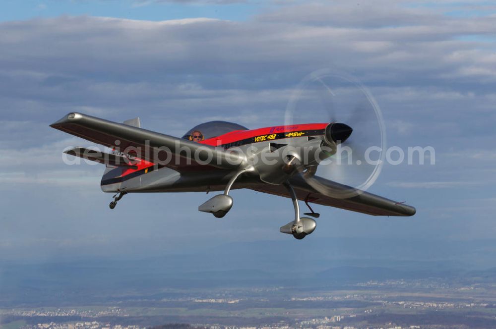 Aerial photograph Birrfeld - Kunstflugzeug / Flugzeug vom Typ VOTEC 452 mit der schweizer Kennung HB-YNH nahe dem Flugplatz Birrfeld / Schweiz. Aerobatic aircraft near by the Birrfeld airfield in Switzerland.