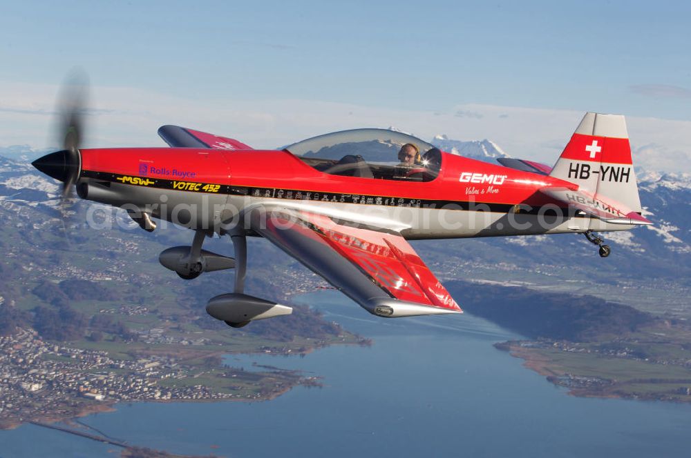 Aerial image Birrfeld - Kunstflugzeug / Flugzeug vom Typ VOTEC 452 mit der schweizer Kennung HB-YNH nahe dem Flugplatz Birrfeld / Schweiz. Aerobatic aircraft near by the Birrfeld airfield in Switzerland.