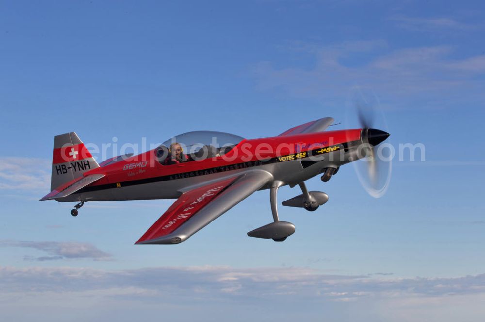 Aerial photograph Birrfeld - Kunstflugzeug / Flugzeug vom Typ VOTEC 452 mit der schweizer Kennung HB-YNH nahe dem Flugplatz Birrfeld / Schweiz. Aerobatic aircraft near by the Birrfeld airfield in Switzerland.