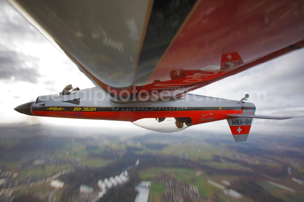 Birrfeld from the bird's eye view: Kunstflugzeug / Flugzeug vom Typ VOTEC 452 mit der schweizer Kennung HB-YNH nahe dem Flugplatz Birrfeld / Schweiz. Aerobatic aircraft near by the Birrfeld airfield in Switzerland.