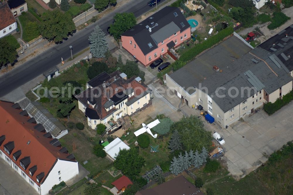 Berlin from above - Mixing of residential and commercial settlements along the Lindenberger Strasse in the district Wartenberg in Berlin, Germany