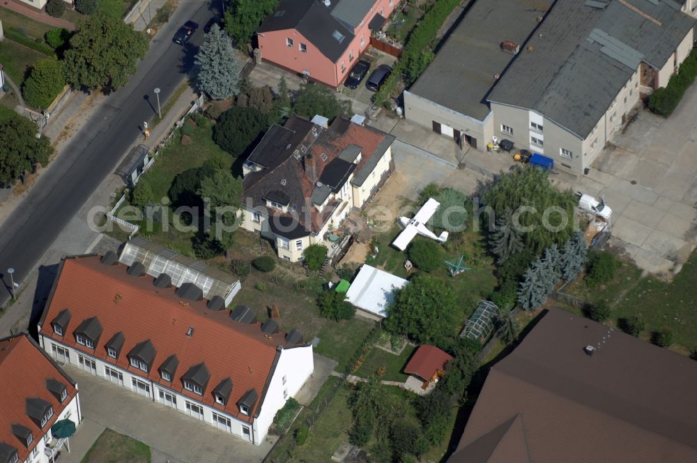 Berlin from the bird's eye view: Mixing of residential and commercial settlements along the Lindenberger Strasse in the district Wartenberg in Berlin, Germany