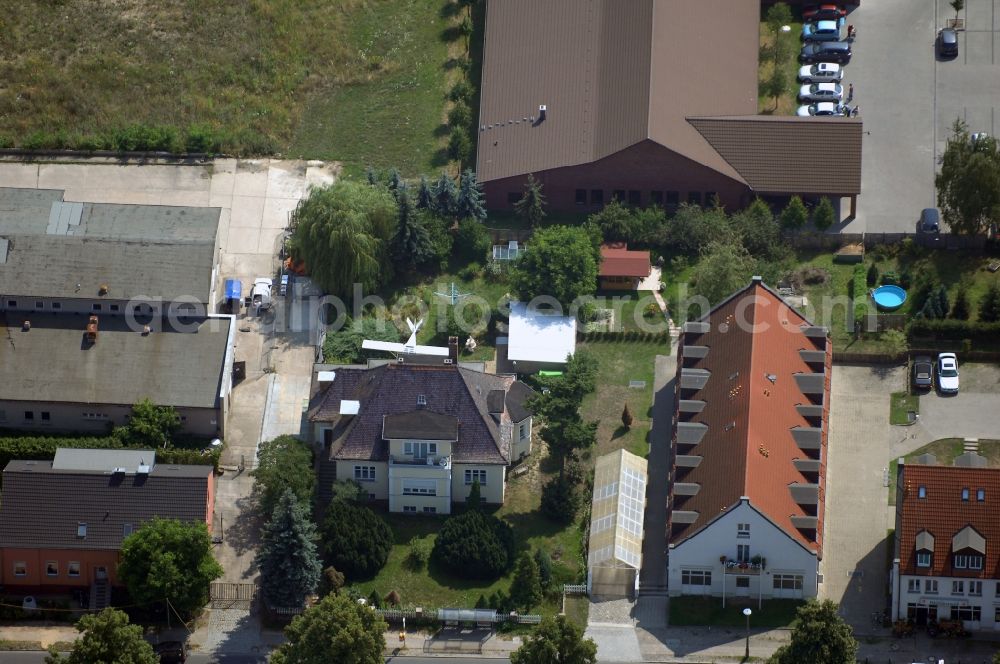 Berlin from above - Mixing of residential and commercial settlements along the Lindenberger Strasse in the district Wartenberg in Berlin, Germany