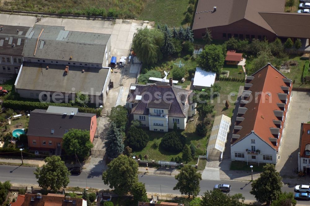 Berlin from the bird's eye view: Mixing of residential and commercial settlements along the Lindenberger Strasse in the district Wartenberg in Berlin, Germany