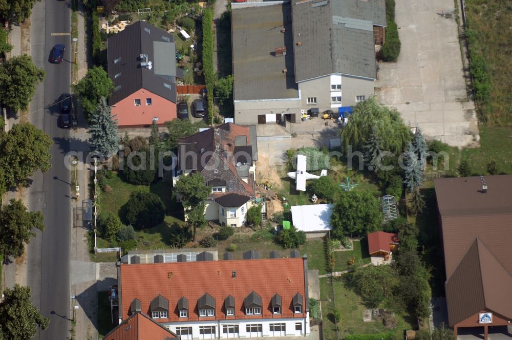 Berlin from above - Mixing of residential and commercial settlements along the Lindenberger Strasse in the district Wartenberg in Berlin, Germany