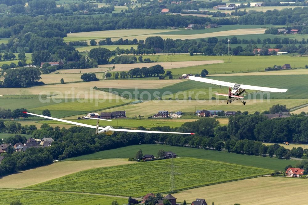 Hamm from above - Aerotowing association with an Aeronca Champion 7GCB D ECVY as a tow plane and a power-seater sailplane DG 300 over Hamm in North Rhine-Westphalia