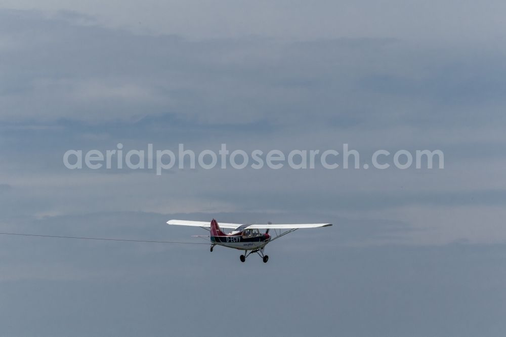 Aerial image Hamm - Aerotowing association with an Aeronca Champion 7GCB D ECVY as a tow plane and a power-seater sailplane DG 300 over Hamm in North Rhine-Westphalia