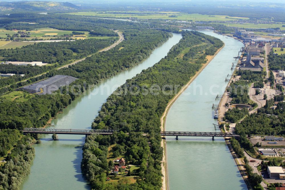 Chalampé from above - River - bridge over the Rhine (left) and the Grand Canal d'Alsace ( right) in Chalampé in France. The combined railway bridge and road bridge is connecting the border town of Neuenburg in Germany with Chalampe in France
