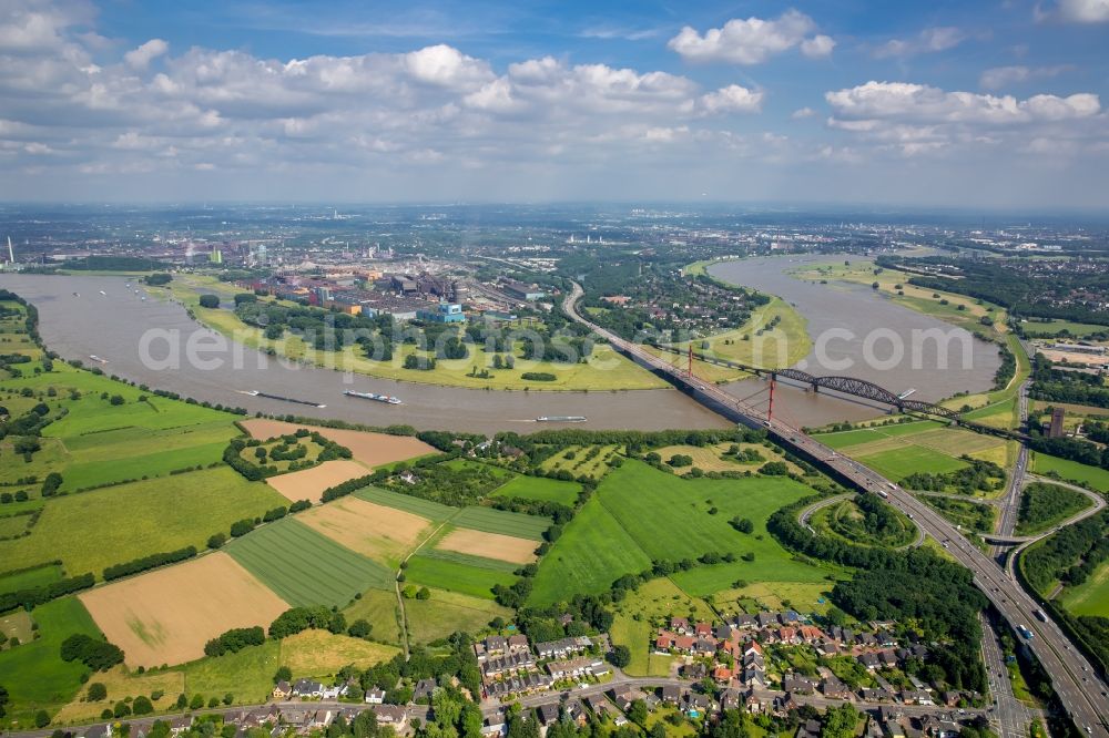 Aerial image Duisburg - River - bridge construction - A42 highway bridge and railway bridge over the Rhine in Duisburg in North Rhine-Westphalia