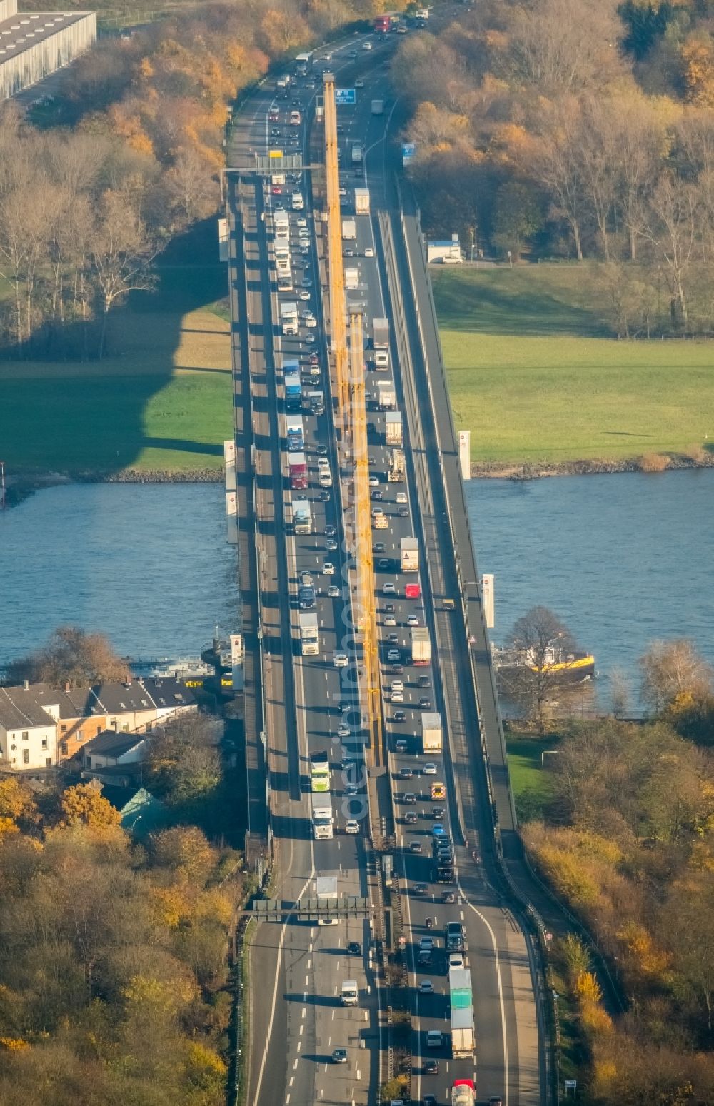 Duisburg from the bird's eye view: River - bridge construction - A42 highway bridge over the Rhine in Duisburg in North Rhine-Westphalia