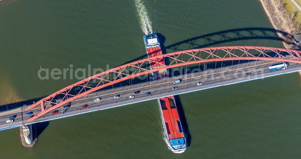 Aerial photograph Duisburg - River - bridge construction Bruecke der Solidaritaet and container ship on the Rhine on Moerser Strasse in the district Hochfeld in Duisburg at Ruhrgebiet in the state North Rhine-Westphalia