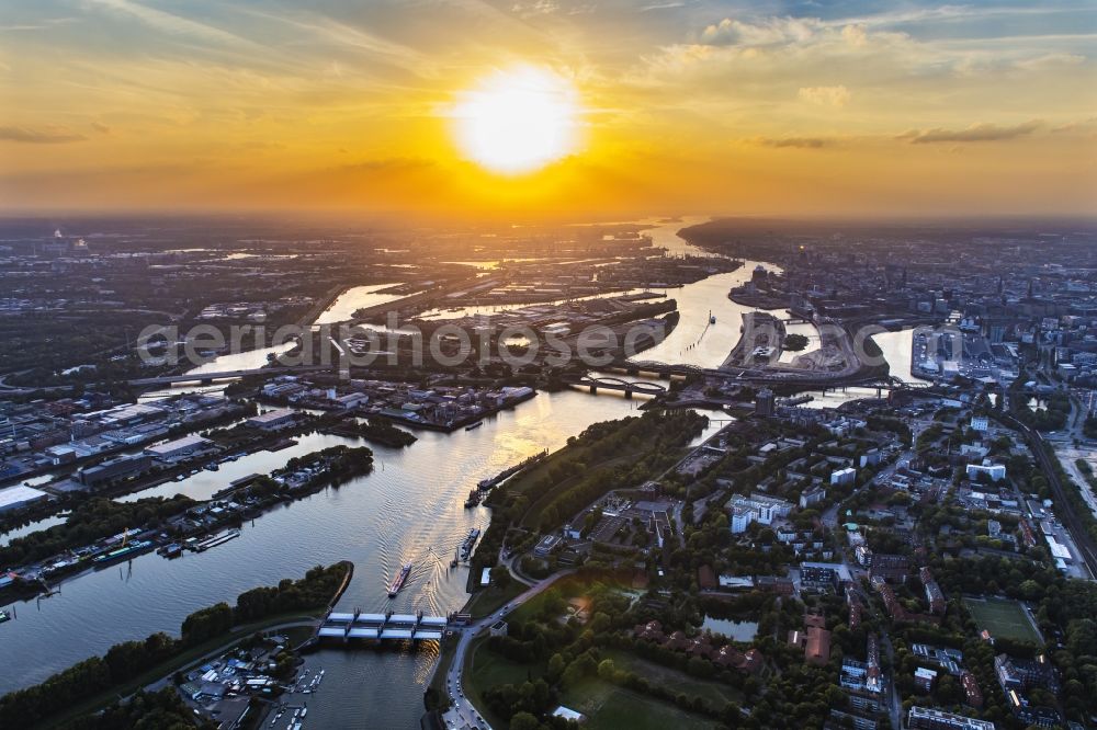 Hamburg from the bird's eye view: River - bridge structure Elbbruecken at sunset - Norderelbbruecke on the banks of the Elbe in Hamburg