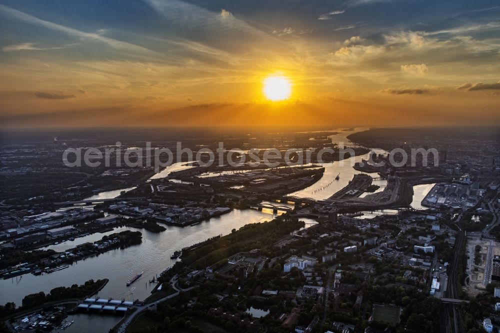 Hamburg from the bird's eye view: River - bridge structure Elbbruecken at sunset - Norderelbbruecke on the banks of the Elbe in Hamburg