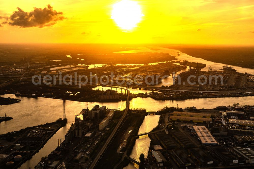 Hamburg from above - River bridge structure of a cable-stayed bridge Koehlbrandbruecke in the sunset over the Rugenberg harbor in the Steinwerder district in Hamburg, Germany