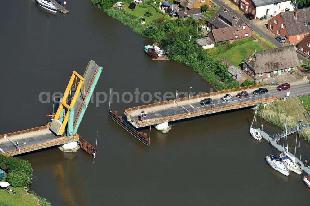 Heiligenstedten from the bird's eye view: River - bridge construction the bascule bridge on the banks of the Stoer river path in Heiligenstedten in the state Schleswig-Holstein