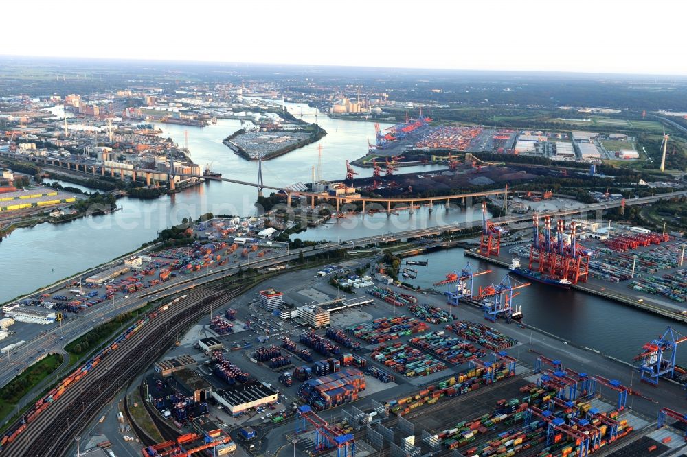 Aerial photograph Hamburg - View of the river - bridge construction der Kohlbrandbruecke over the river Elbe and the Port Waltershof with countless containers and cranes in Hamburg in Germany