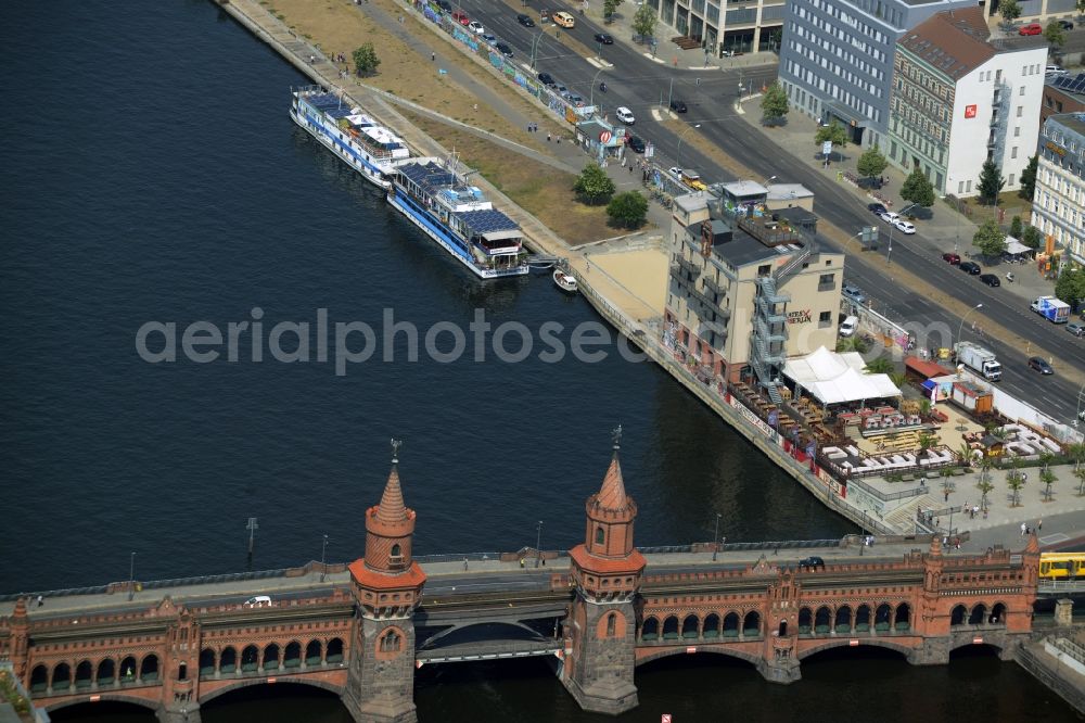 Berlin from above - River - bridge structure Oberbaumbruecke over the banks of the Spree between Kreuzberg and Friedrichshain in Berlin