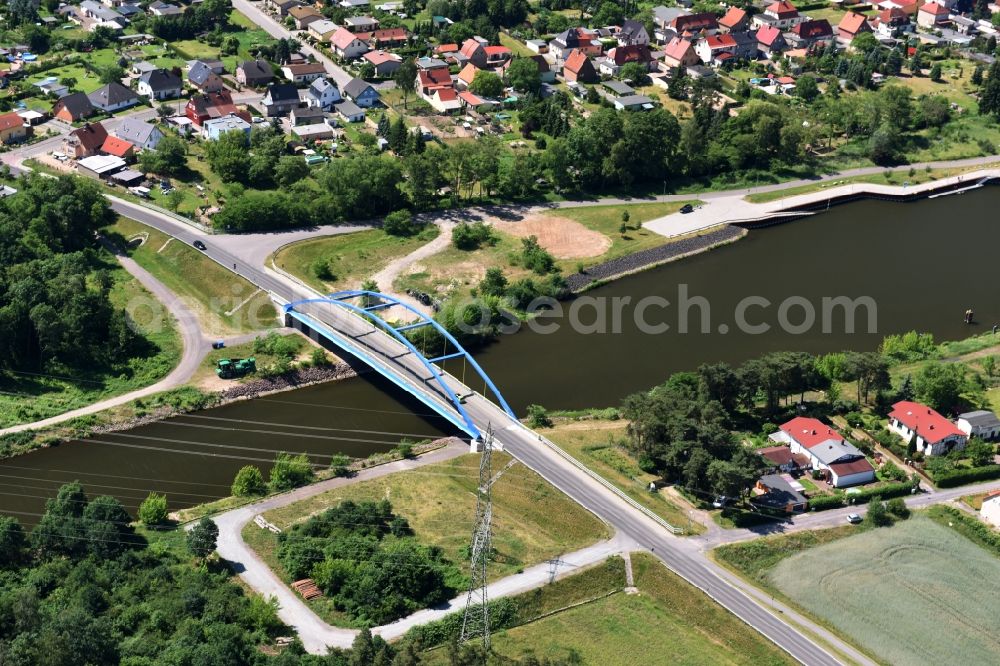 Wusterwitz from above - Strassenbruecke Wusterwitz Bridge across the Elbe-Havel-Canal in the North of Wusterwitz in the state of Brandenburg. The county road L96 takes its course across the blue steel arc bridge